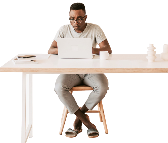 person coding on laptop on desk